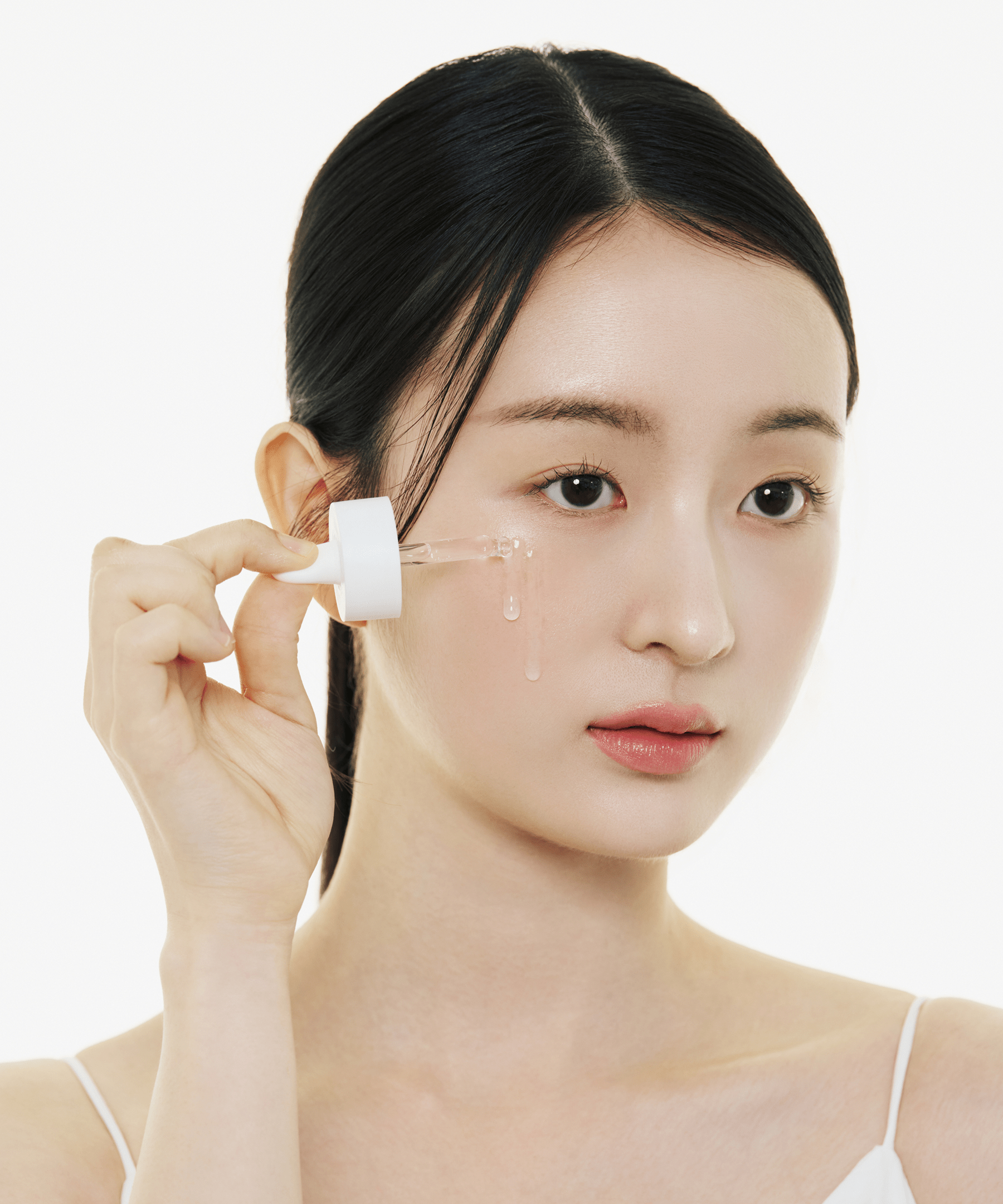female model using NIACINAMIDE 10 BOOSTING SHOT AMPOULE